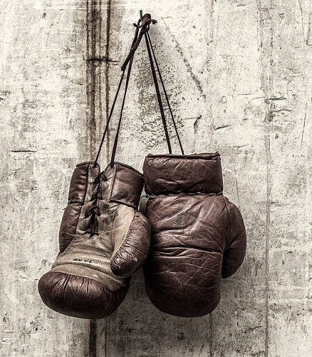 Retro boxing gloves hanging on wall Retro boxing gloves hanging on wall
